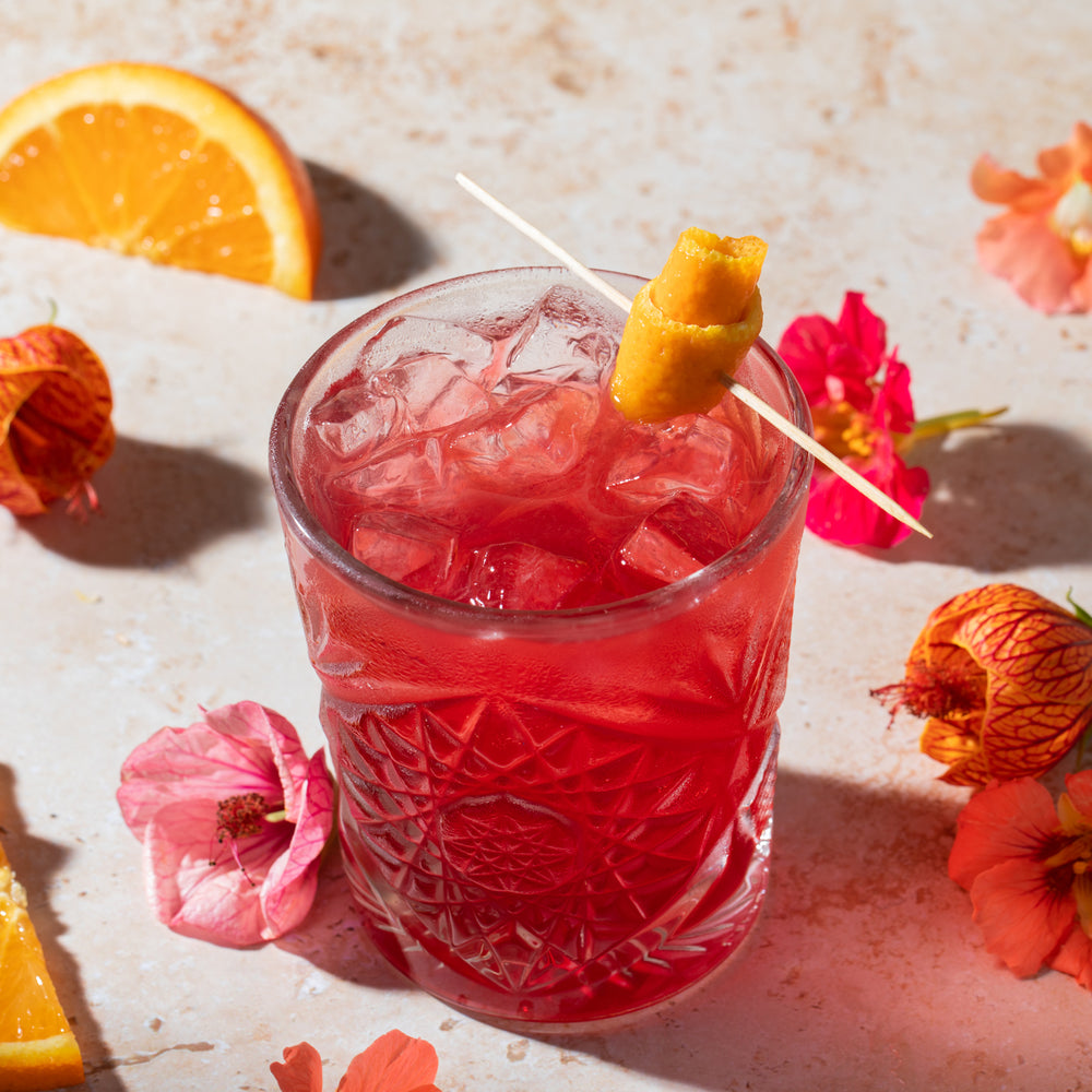 Summer Fling mocktail beverage with orange peel garnish.