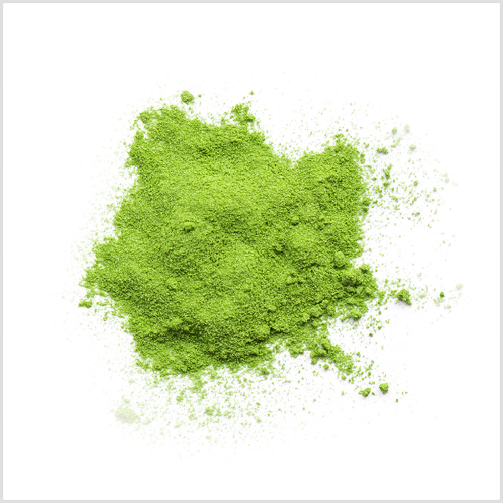 Bright green Matcha Latte Mix powder in a rugged pile to show quality and color.